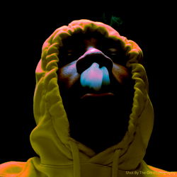 Hip Hop Artist in Vibrant Hoodie, Smoking