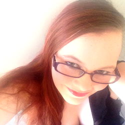 Cute Red-Headed Girl in a Glasses with Blonde Hair