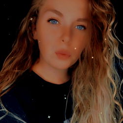 Alissa, a beautiful young woman with blonde hair and blue eyes captures the essence of youthful beauty.