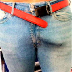 Denim Fashion Showcasing Blue Jeans with a Red Belt and Buckle