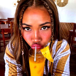 Stylish Model Angel Poses with a Drink