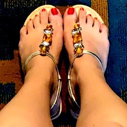 Woman's Foot with Gold Sandal and Jade Jewelry