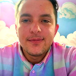 Smiling Man in Vivid Rainbow Shirt with Cloud-like Background