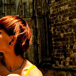 Chic Traveler in Spain, Standing Before Historic Church