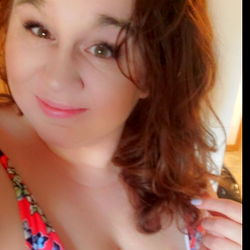 Candace, a OnlyFans model in a colorful bikini