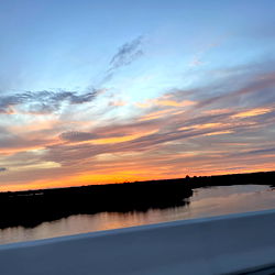 Sunset with Calm Waters and Bridge