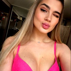 OnlyFans model Christina posing in pink lingerie