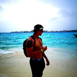 A fit young man enjoying a sunny day at the beach