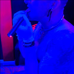 OnlyFans Model MonkPunk with E-cigarette in Blue Lighting