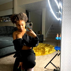 Honey in a Sleek Black Outfit