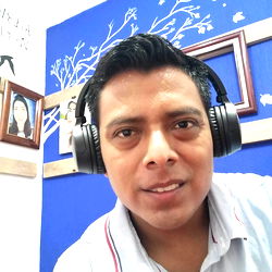 Friendly Guy with Headphones in a Studio