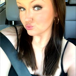 Stylish Woman in Black Tank Top Posing for Selfie