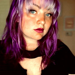 A Person with Violet Hair and Black Shirt