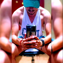 Chilean Fitness Model Taking a Break with Cellphone