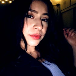 Jaz, a model posing for the camera with a casual yet stylish look.