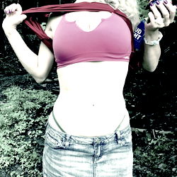 A Model Showcasing Her Tight Abs and Pink Sports Bra