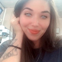 Young Woman with Tattoos, Posing for Selfie