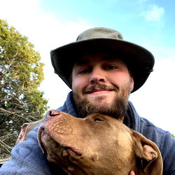 Man with Dog in Outdoor Setting