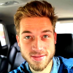 Bearded Man Smiling in Car