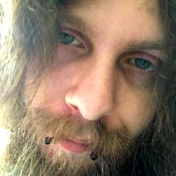 Bearded Man with Piercings and Tattoo, Maine