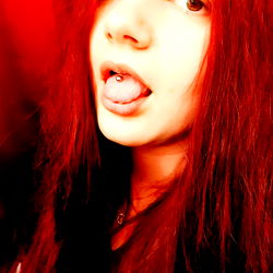 Vibrant Red Hair Model with Tongue Out