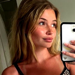 Blonde Model Poses for Phone Camera