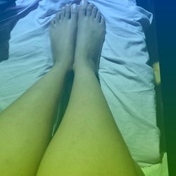 Vivid Toe Nail Art on a Bed