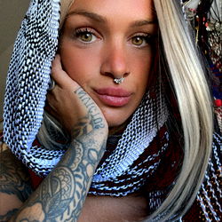 Fashionable Onlyfans Model Posing with Snake Scarf