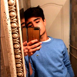 Baddieboy in a Blue Sweater, Taking a Selfie