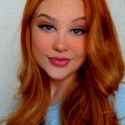 Gorgeous Woman with Red Hair and Blue Shirt