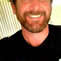 Shawn, the bearded man with a big smile