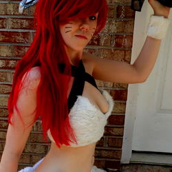 Onlyfans Model Showcasing Wolf Cosplay in Cat-like Form, Holds Sword, and Wields Crossbow