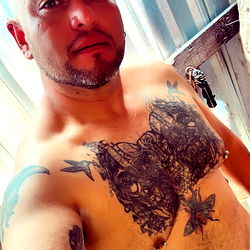 Shirtless Man with Tattoos