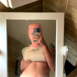 Model X.Bethany.X in a bathroom mirror, 2022