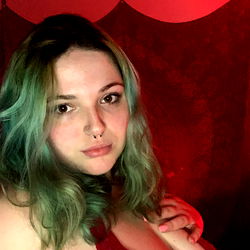 Stylish model Ali-Renée in striking green hair