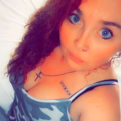 Angielinn, a young and vibrant model with tattoos