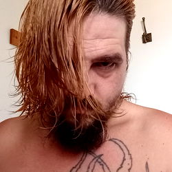 Bearded Man with Tattoos in Bathrobe