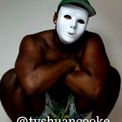 Crouching OnlyFans Model in Masked Performance