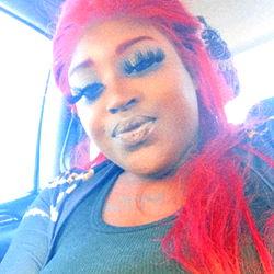 Fanci, the Onlyfans Model from Sacramento, Showcasing Her Stylish Red Hair and Bright Smile in the Car