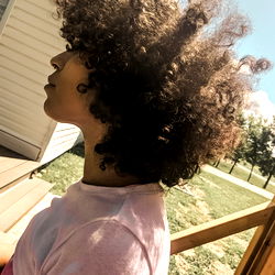 Emotional Girl in Casual Outfit on Porch
