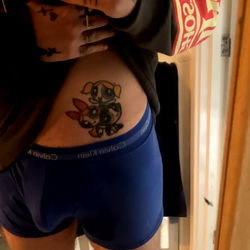 Tattoo-Covered Model Showcasing Tattoos and Fashion