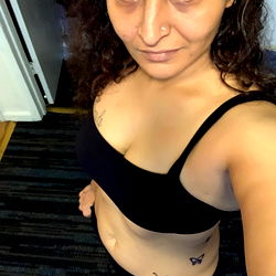 Fitness-oriented model showcasing body confidence in sports attire