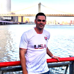 Big Red Posing at a Sporting Event with the Brooklyn Bridge in the Background