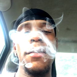 Viral Smoke Photograph of Young Man in Vehicle with Blurred Background