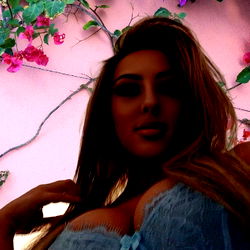 A Woman in a Blue Lingerie Posing for the Camera