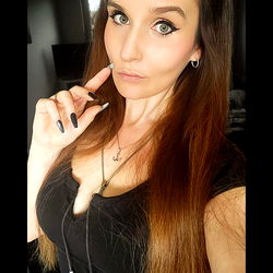 OnlyFans Model Raina Poses for Selfie