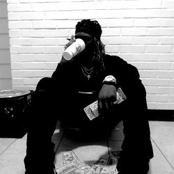 OG HEF, A Rapper in Atlanta, Sitting on the Floor With a Cup of Coffee and Money