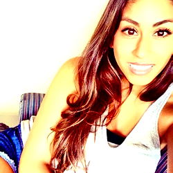 Smiling woman with long hair, taking a selfie