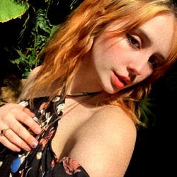 Beautiful Red-Haired Woman Posing for a Photo