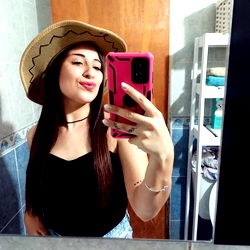 Smiling Woman in Cowgirl Hat Posing for Selfie